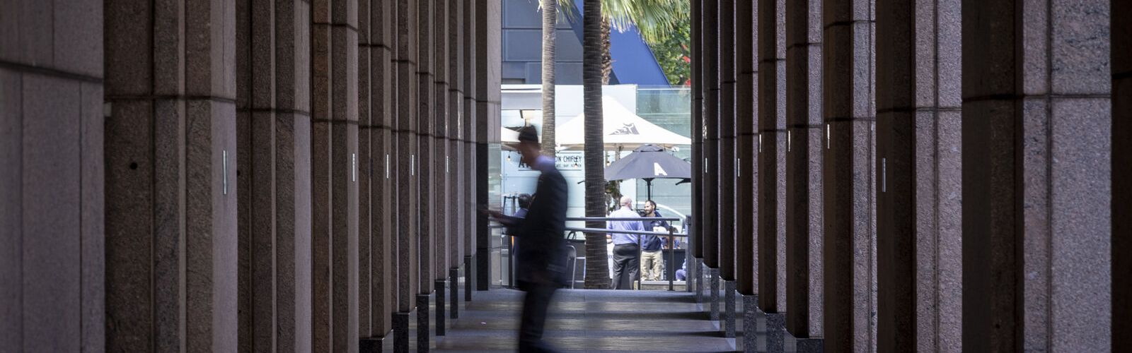 Man walking through building