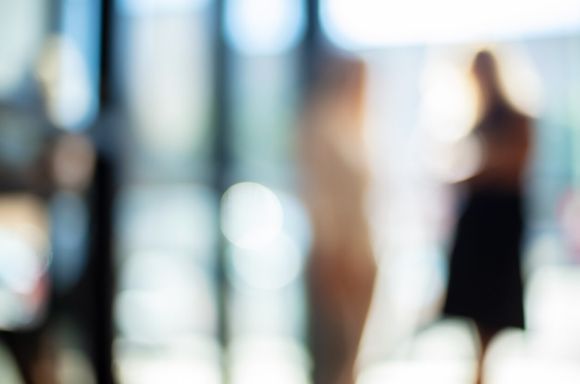 blurred people in office