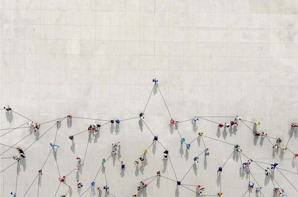 crowd from above forming a growth graph