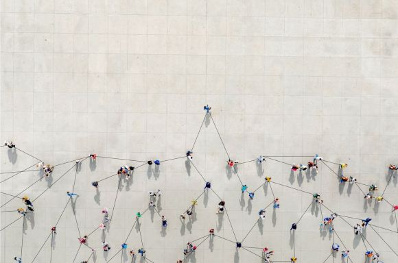 crowd from above forming a growth graph