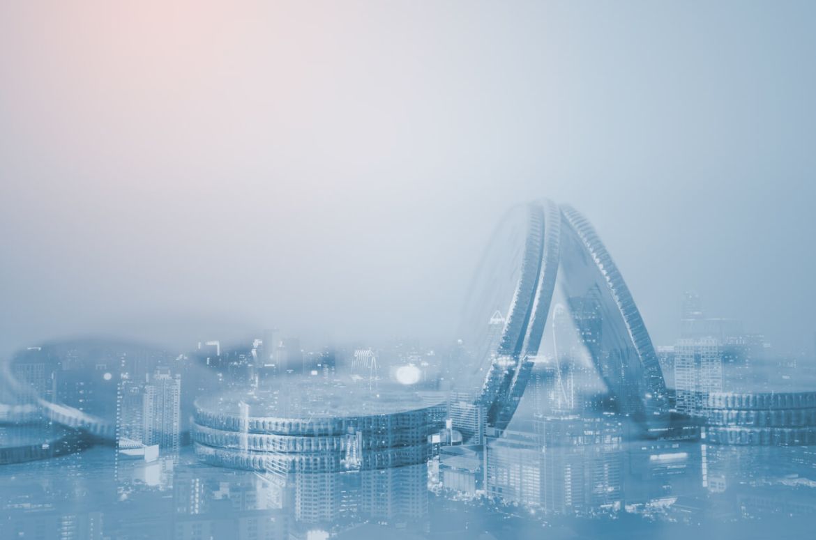 Double exposure of close up coins and city night in blue tone