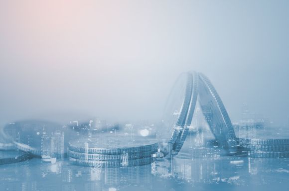 Double exposure of close up coins and city night in blue tone