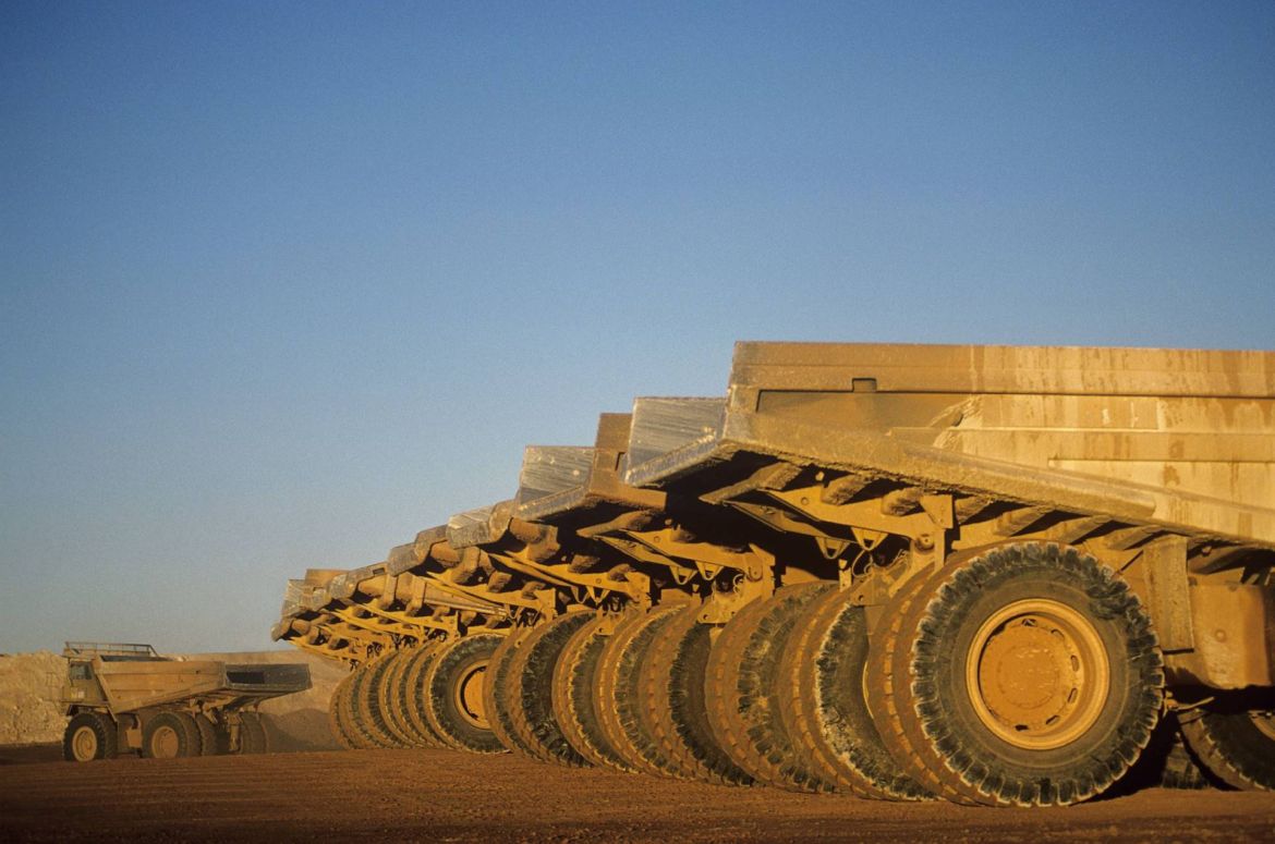 Ore hauling trucks in row