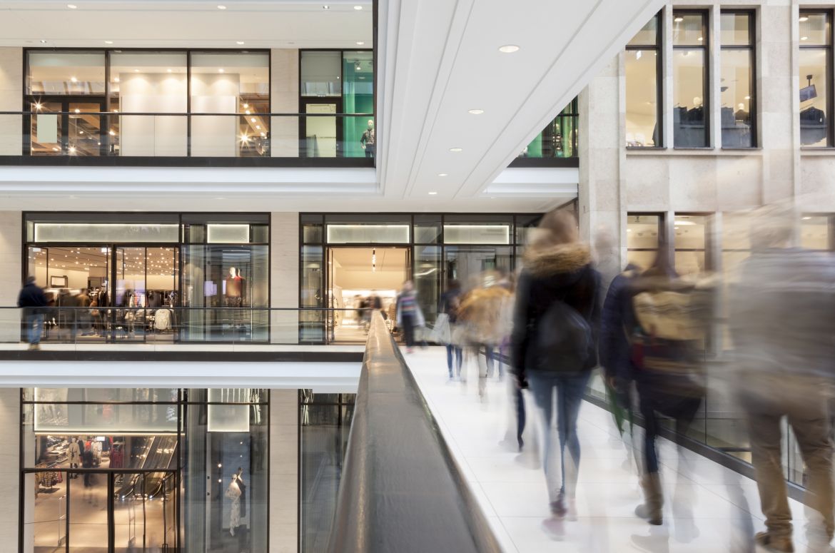 Shoppers walking in shopping centre