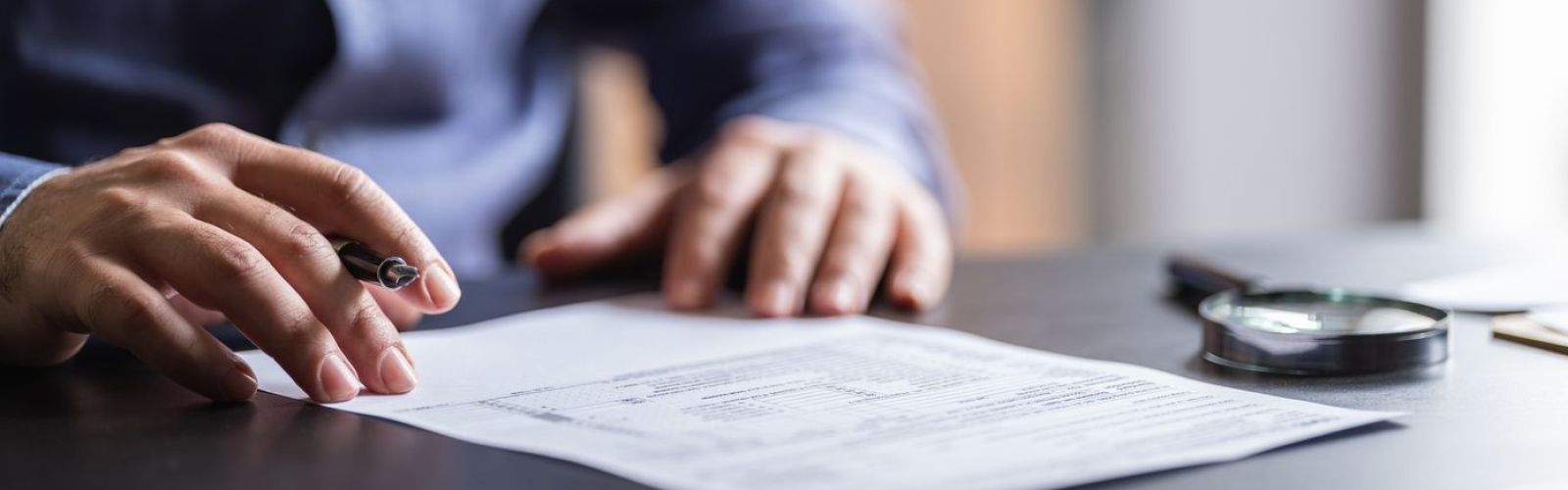 Man Filling In The Tax Form
