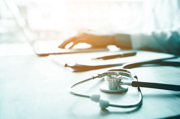 Doctor working on laptop