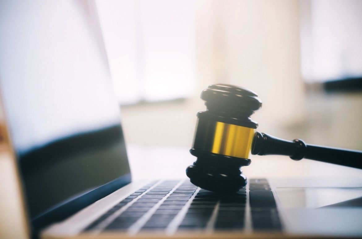 Gavel with laptop gold