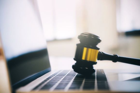 Gavel with laptop gold