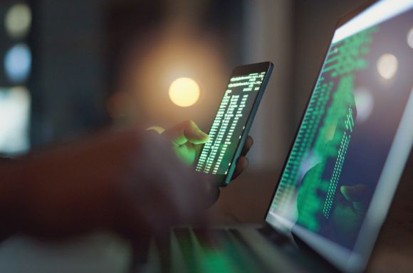 Hacker using phone
