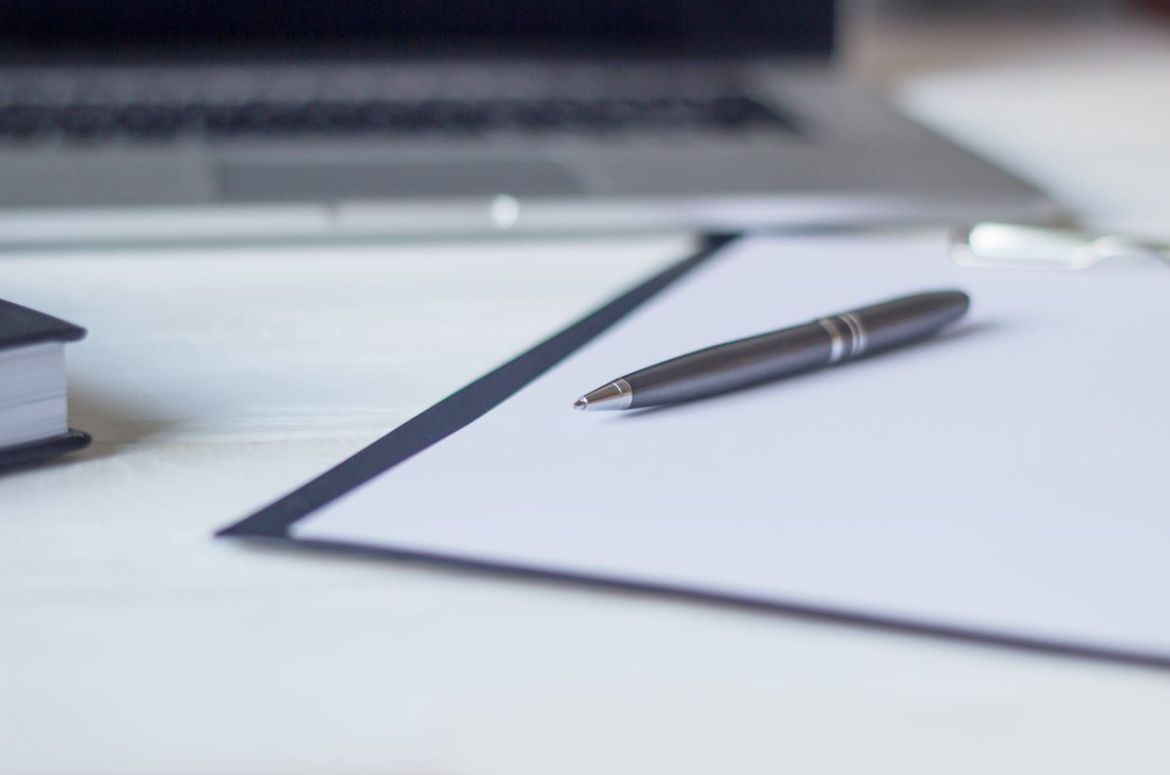 Laptop and documents in the workplace