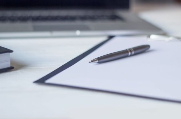 Laptop and documents in the workplace