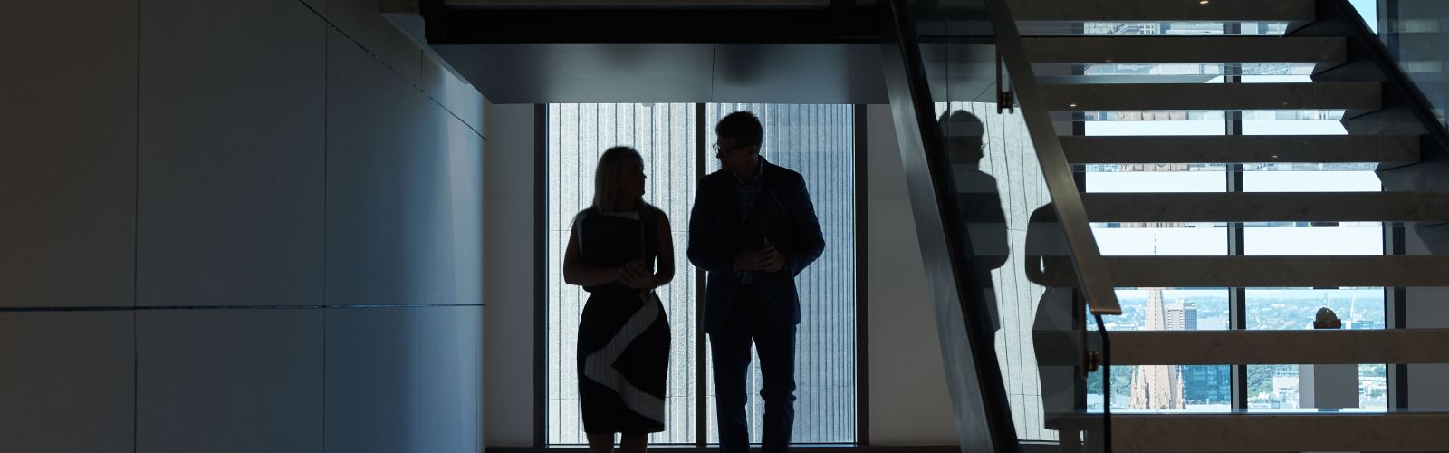 Man and woman silhouette next to stairs 1