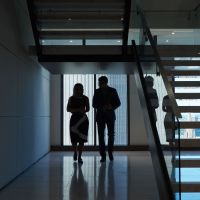 Man and woman silhouette next to stairs 1