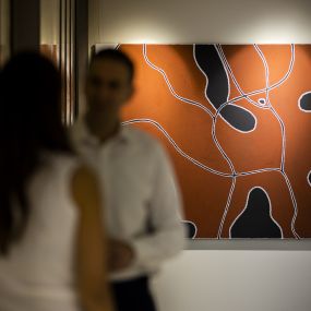Paintings in Sydney office hallway 8