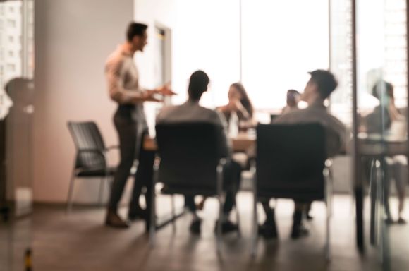 People blurred in meeting room