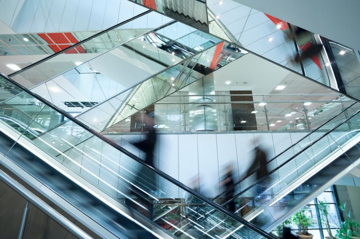 People on escalators at shopping mall v2