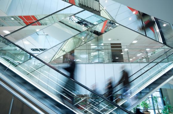 People on escalators at shopping mall v2