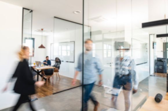 People walking in office blurred