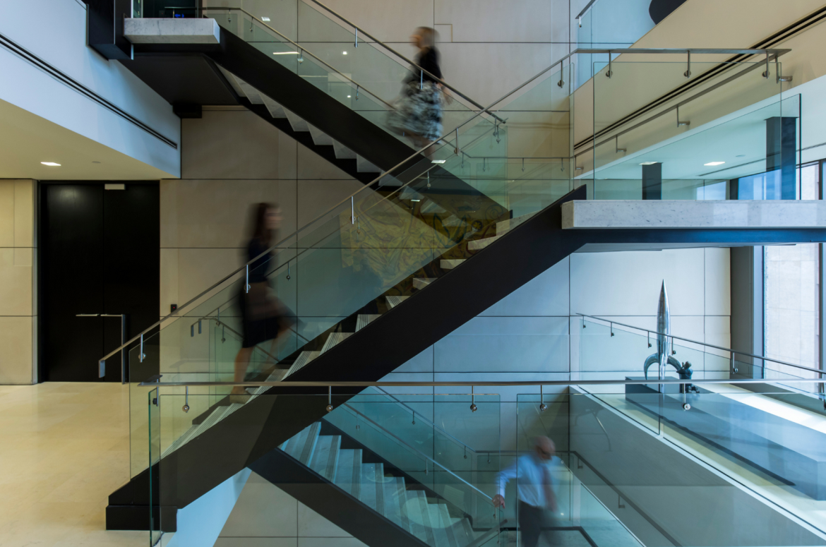 People walking on ABL Melbourne office staircase