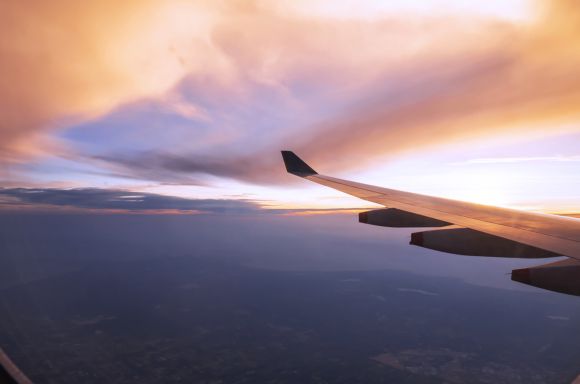 Plane flying over clouds