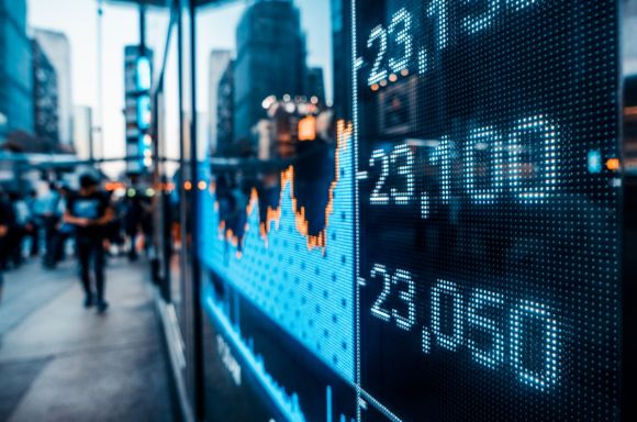 Stock market numbers and city light reflection