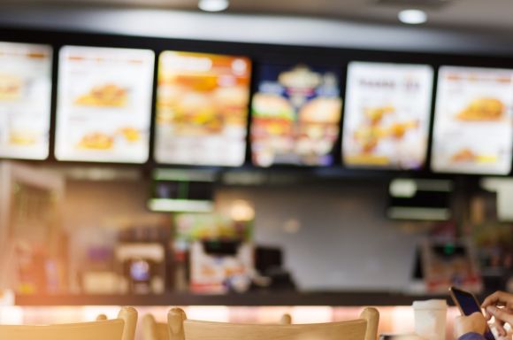blur image of fast food restaurant use for defocused background picture id1145578527 1