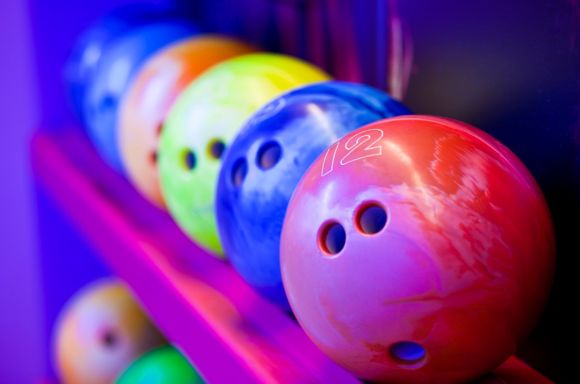 bowling balls on ball shelves picture id157678057