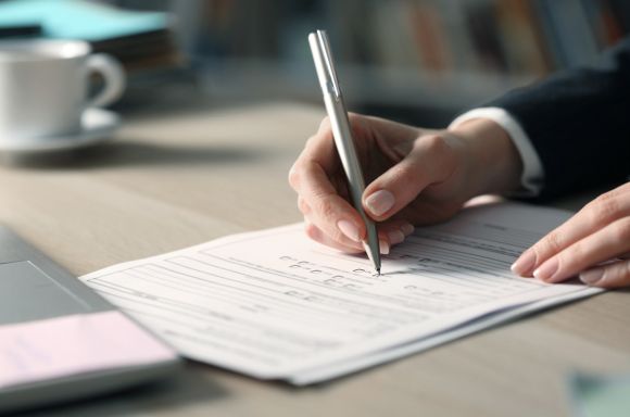filling out form iStock 1220106897