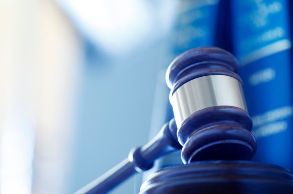 gavel in front of row of law books picture id637294178