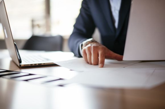 Businessman working in blue suit at the office