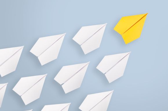 leadership concepts with yellow paper airplane leading among white picture id1133438274
