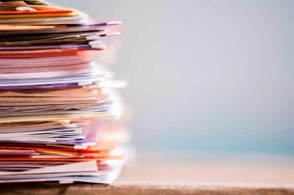 stack of paper files 